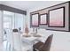 Modern dining room with white table and chairs, adjacent to kitchen at 1060 Leader St, Davenport, FL 33896