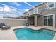 Private screened pool and patio with lounge chairs at 1060 Leader St, Davenport, FL 33896