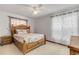 Bedroom with wood-framed bed and ocean-themed bedding at 110 Dianne Dr, Ormond Beach, FL 32176