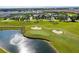 Aerial view of community with resort-style pool, clubhouse, and golf course at 1176 Challenge Dr, Davenport, FL 33896