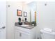 Clean bathroom with vanity, toilet, and mirror at 1176 Challenge Dr, Davenport, FL 33896