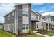 Modern two-story home with gray exterior and stone accents at 1176 Challenge Dr, Davenport, FL 33896