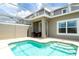 Enjoy this private pool and patio with table and chairs at 1176 Challenge Dr, Davenport, FL 33896