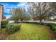 Side yard with green grass and AC unit at 12002 Great Commission Way, Orlando, FL 32832