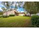 Large backyard with green grass and trees at 12002 Great Commission Way, Orlando, FL 32832