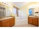 Bathroom with double sinks, corner tub, and shower at 12002 Great Commission Way, Orlando, FL 32832