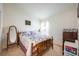 Bedroom with wooden bed and full-length mirror at 12002 Great Commission Way, Orlando, FL 32832