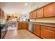 Kitchen with wooden cabinets, stainless steel appliances, and granite countertops at 12002 Great Commission Way, Orlando, FL 32832