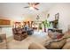 Open living room with access to the backyard and kitchen at 12002 Great Commission Way, Orlando, FL 32832