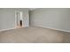 Large bedroom with carpet and access to bathroom at 1232 White Ash Loop, Deland, FL 32720