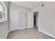 Bright bedroom with wood-look floors and ample closet space at 124 Mercado Ave, Orlando, FL 32807