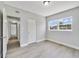 Bedroom with large window, and gray flooring at 124 Mercado Ave, Orlando, FL 32807