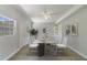 Dining room with marble table, white chairs, and hardwood floors at 124 Mercado Ave, Orlando, FL 32807