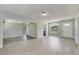 Open living room with grey vinyl flooring and lots of natural light at 124 Mercado Ave, Orlando, FL 32807