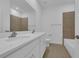 Bathroom with double sinks, shower, and bathtub at 1244 White Ash Loop, Deland, FL 32720