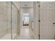 Bathroom with shower, tiled walls, and view of bedroom at 1244 White Ash Loop, Deland, FL 32720