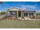 House exterior features gray siding, landscaping, and palm tree at 1244 White Ash Loop, Deland, FL 32720