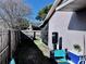 Long backyard with wooden fence and covered patio at 1332 Azalea Way, Winter Garden, FL 34787