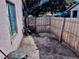 Small, fenced backyard with dirt ground at 1332 Azalea Way, Winter Garden, FL 34787