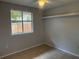 Neutral bedroom featuring tile flooring, a ceiling fan, and window providing natural light at 1332 Azalea Way, Winter Garden, FL 34787