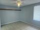 Neutral bedroom with tile flooring, a ceiling fan, and window providing natural light at 1332 Azalea Way, Winter Garden, FL 34787