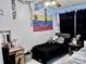 Bedroom with twin bed, desk, and Venezuelan flag at 1332 Azalea Way, Winter Garden, FL 34787