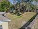 Spacious backyard with wooden fence and large trees at 137 N Nowell St, Orlando, FL 32835