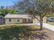 House with a large yard and a tree-lined street at 137 N Nowell St, Orlando, FL 32835