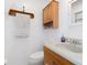 Clean bathroom with wood vanity, single sink, and updated fixtures at 137 N Nowell St, Orlando, FL 32835