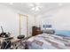 Bright bedroom with a queen bed, wood flooring, and ceiling fan at 137 N Nowell St, Orlando, FL 32835