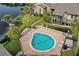 Aerial view of kidney-shaped community pool with surrounding patio and lounge chairs at 144 Maitland Ave # A, Altamonte Springs, FL 32701