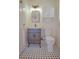 Bathroom with a vanity, toilet, and a white-and-black checkered floor at 1516 17Th Nw St, Winter Haven, FL 33881