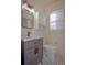 Bathroom with a vanity, toilet, and a window with blinds at 1516 17Th Nw St, Winter Haven, FL 33881