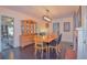 Elegant dining room features a wood table and fireplace at 1516 17Th Nw St, Winter Haven, FL 33881