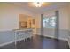 Charming dining area with dark hardwood floors at 1516 17Th Nw St, Winter Haven, FL 33881