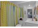 Small bathroom with a shower/tub combo and a white vanity at 1611 Walnut Ave, Winter Park, FL 32789