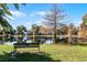 Scenic community lake with a park-like setting and a bench for relaxation at 1611 Walnut Ave, Winter Park, FL 32789