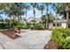 White house with palm trees and a large concrete driveway at 1611 Walnut Ave, Winter Park, FL 32789