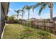 Private backyard with wooden fence and small trees at 1621 Riveredge Rd, Oviedo, FL 32766