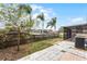 Large backyard with patio, screened enclosure, and wooden fence at 1621 Riveredge Rd, Oviedo, FL 32766