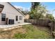 Grass backyard with patio, wooden fence, and air conditioning unit at 1621 Riveredge Rd, Oviedo, FL 32766