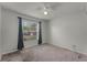 Simple bedroom with ceiling fan and large window at 1621 Riveredge Rd, Oviedo, FL 32766