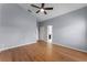 Bright bedroom featuring wood-look floors and ceiling fan at 1621 Riveredge Rd, Oviedo, FL 32766