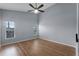 Spacious bedroom with wood-look floors and ceiling fan at 1621 Riveredge Rd, Oviedo, FL 32766