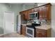 Kitchen with stainless steel appliances and wood cabinets at 1621 Riveredge Rd, Oviedo, FL 32766