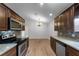 Bright kitchen featuring wood cabinets, granite counters, and stainless steel appliances at 1621 Riveredge Rd, Oviedo, FL 32766