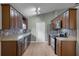 Updated kitchen featuring wood cabinets, granite countertops, and stainless steel appliances at 1621 Riveredge Rd, Oviedo, FL 32766