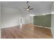 Bright living room featuring wood floors and an accent wall at 1621 Riveredge Rd, Oviedo, FL 32766