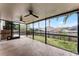 Large screened patio with backyard access and ceiling fans at 1621 Riveredge Rd, Oviedo, FL 32766