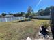 Spacious backyard with a large grassy area and privacy fence at 1901 Griff Wood Ct, Saint Cloud, FL 34772